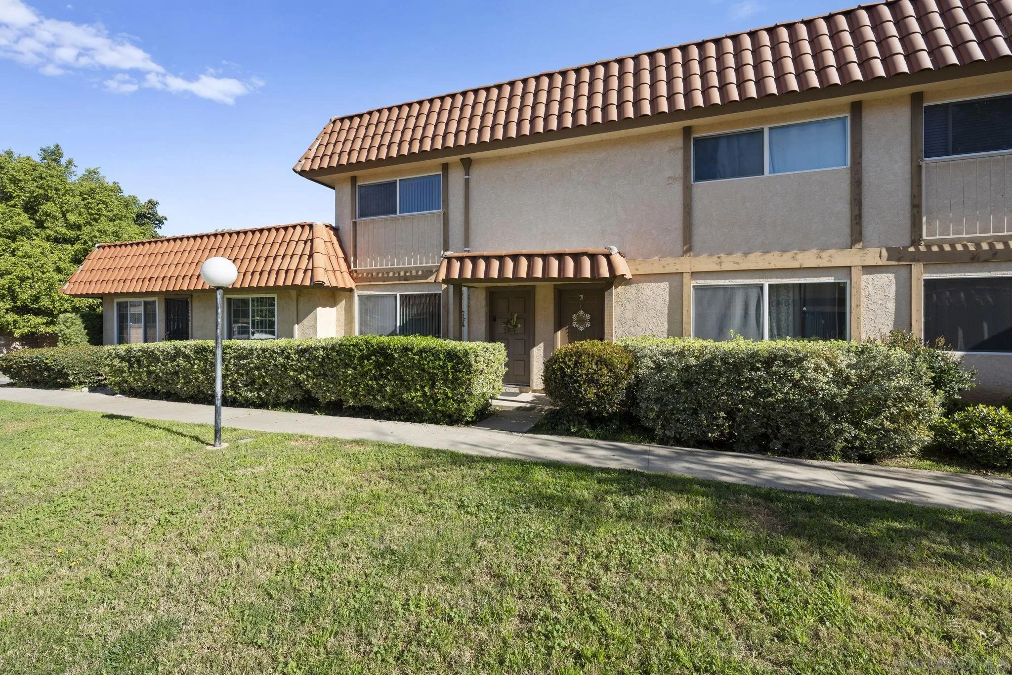 910 North Fig Street, Unit D Escondido, CA 92026 - Photo 4 of 23 a front view of a house with a yard