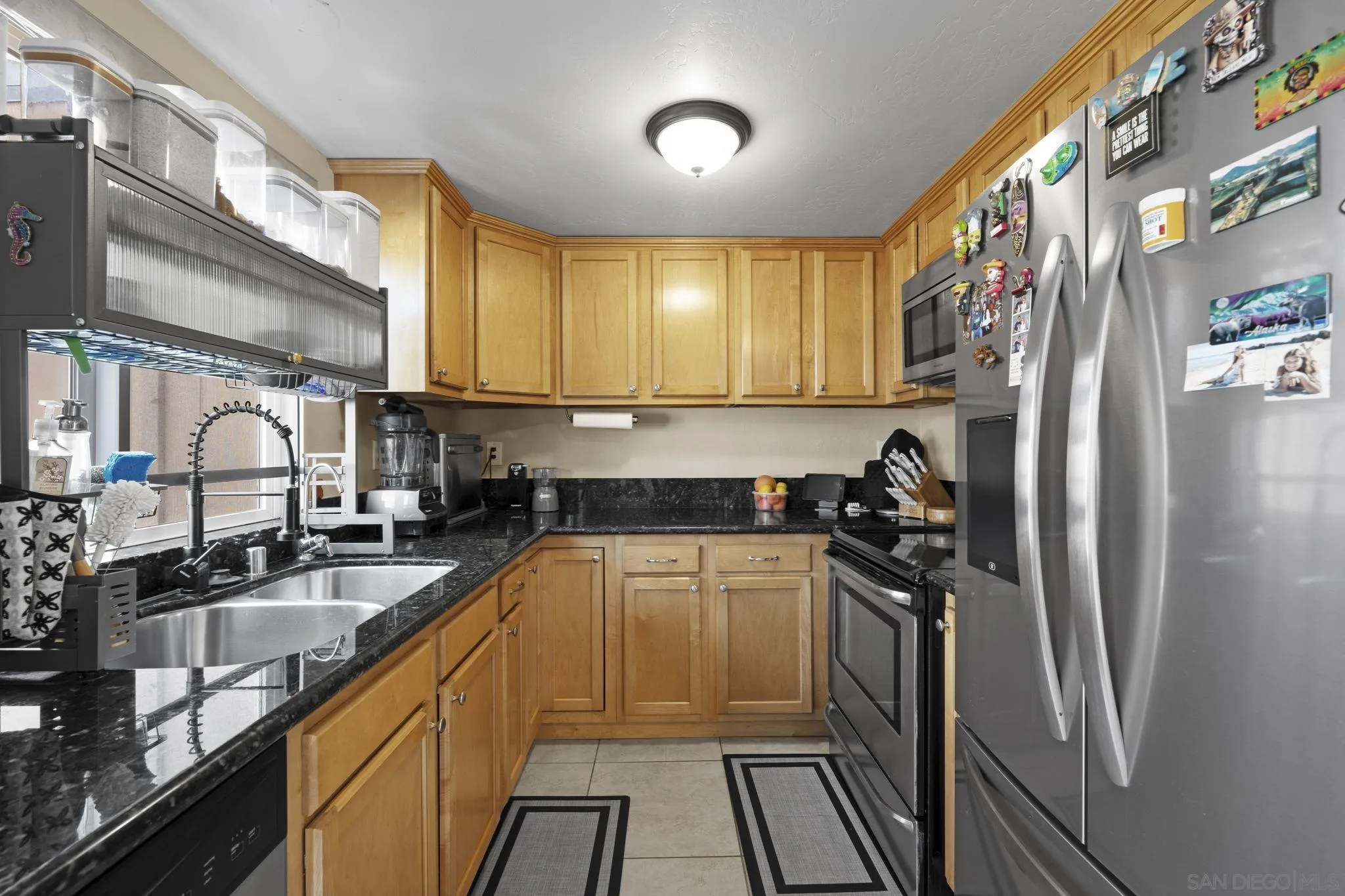 910 North Fig Street, Unit D Escondido, CA 92026 - Photo 9 of 23 a kitchen with a sink appliances cabinets and a counter top space
