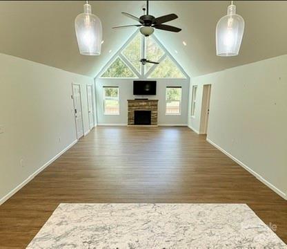 109 Beech Tree Lane Rutherfordton, NC 28139 - Photo 12 of 32 a view of a livingroom with a fireplace a chandelier fan and wooden floor