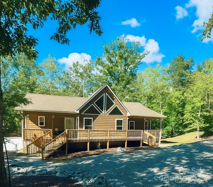 109 Beech Tree Lane Rutherfordton, NC 28139 - Photo 5 of 32 a front view of a house with a yard and trees
