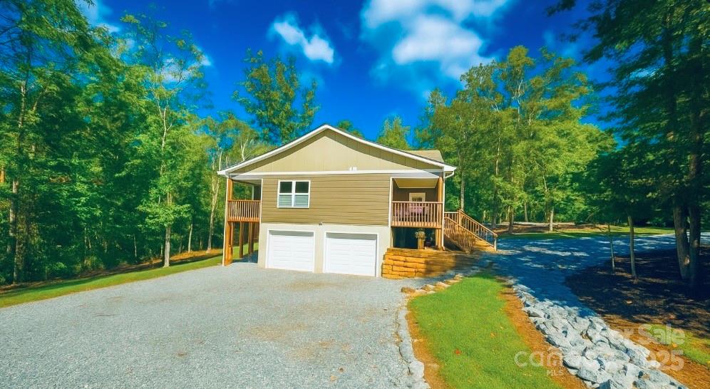 109 Beech Tree Lane Rutherfordton, NC 28139 - Photo 8 of 32 a view of a house with backyard and trees