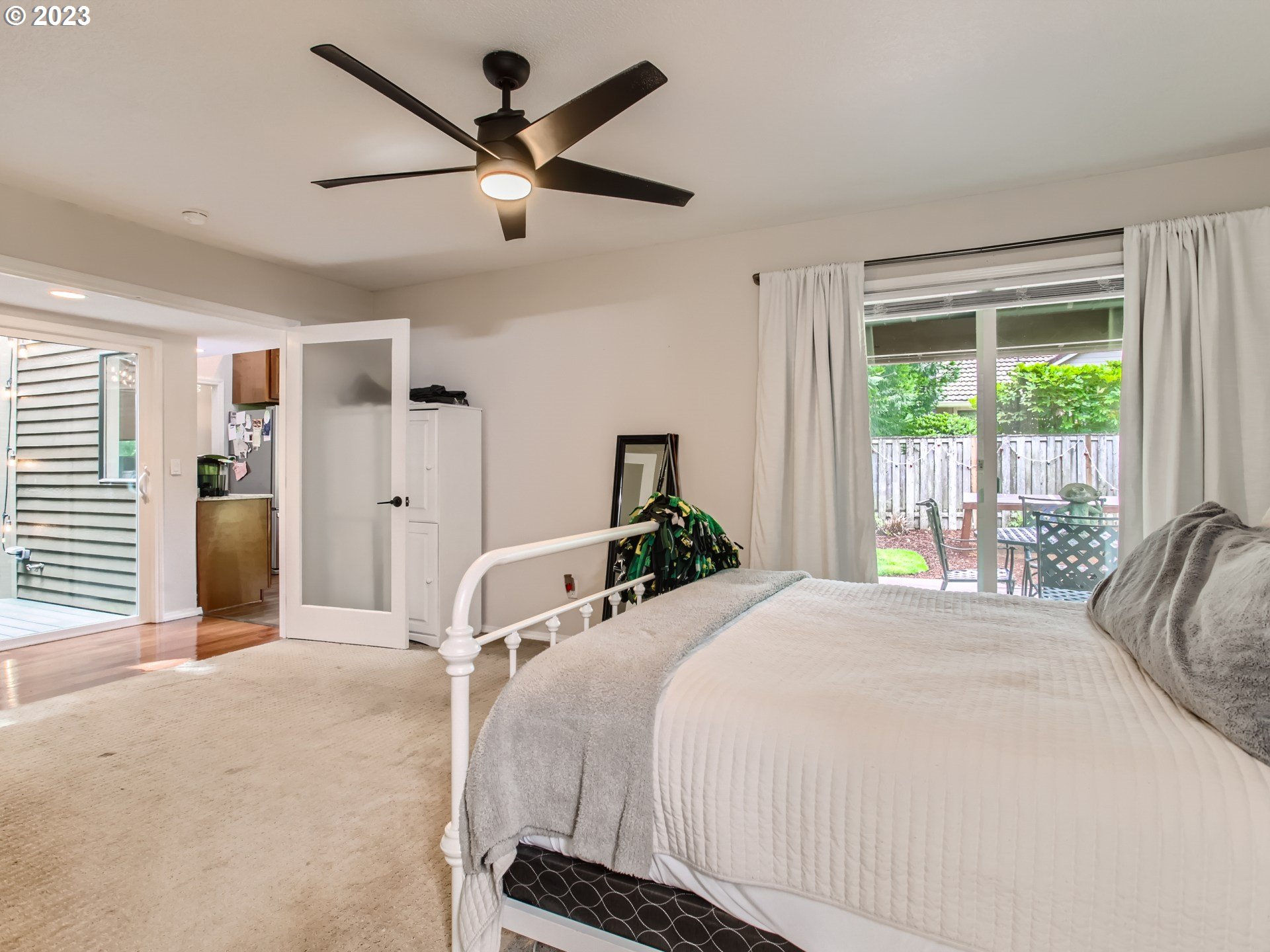 10230 Southwest Kickapoo Court Tualatin, OR 97062 - Photo 15 of 26 a bedroom with a bed and a large window
