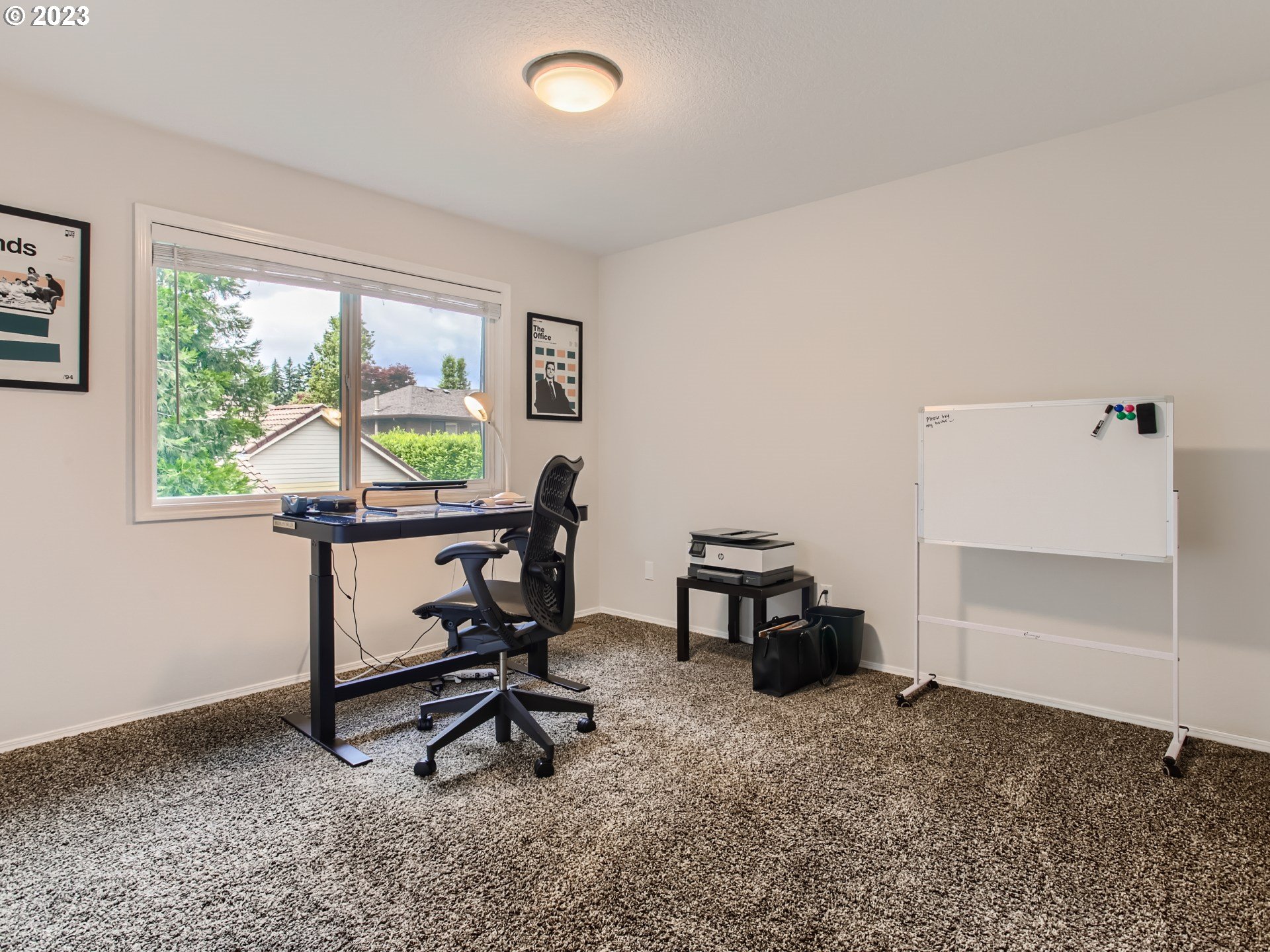 10230 Southwest Kickapoo Court Tualatin, OR 97062 - Photo 17 of 26 a view of a workspace with furniture and a window