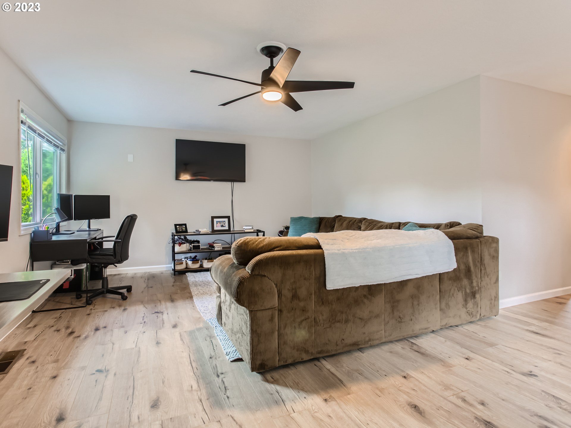 10230 Southwest Kickapoo Court Tualatin, OR 97062 - Photo 21 of 26 a living room with couches and a flat screen tv