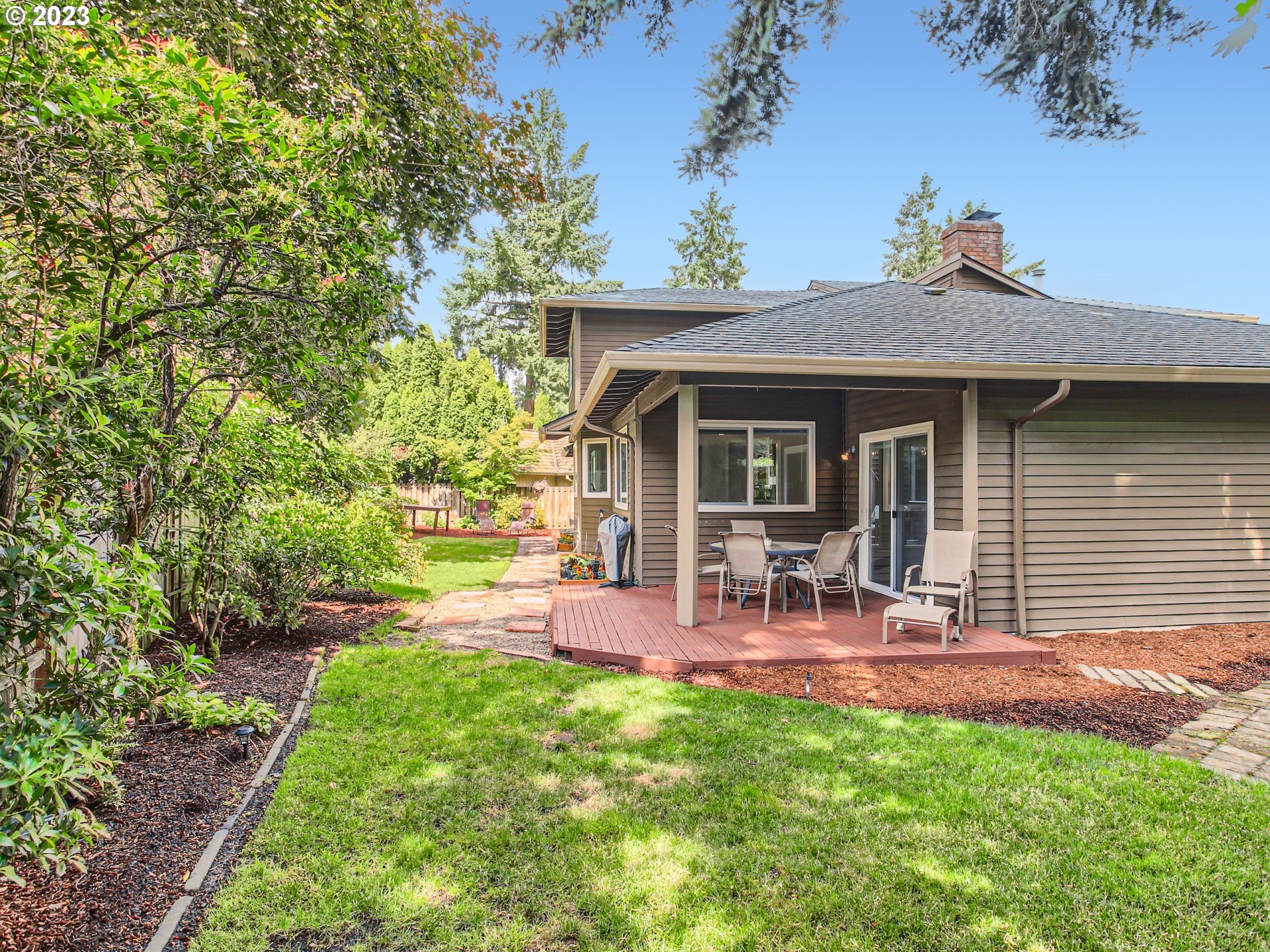 10230 Southwest Kickapoo Court Tualatin, OR 97062 - Photo 24 of 26 a view of a house with a yard porch and sitting area