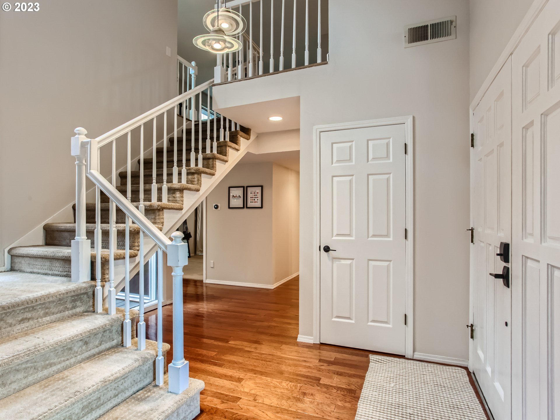 10230 Southwest Kickapoo Court Tualatin, OR 97062 - Photo 4 of 26 a view of entryway and hall with wooden floor