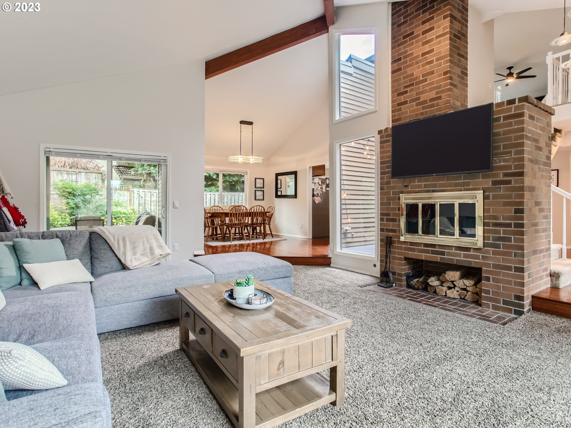 10230 Southwest Kickapoo Court Tualatin, OR 97062 - Photo 5 of 26 a living room with furniture and a fireplace