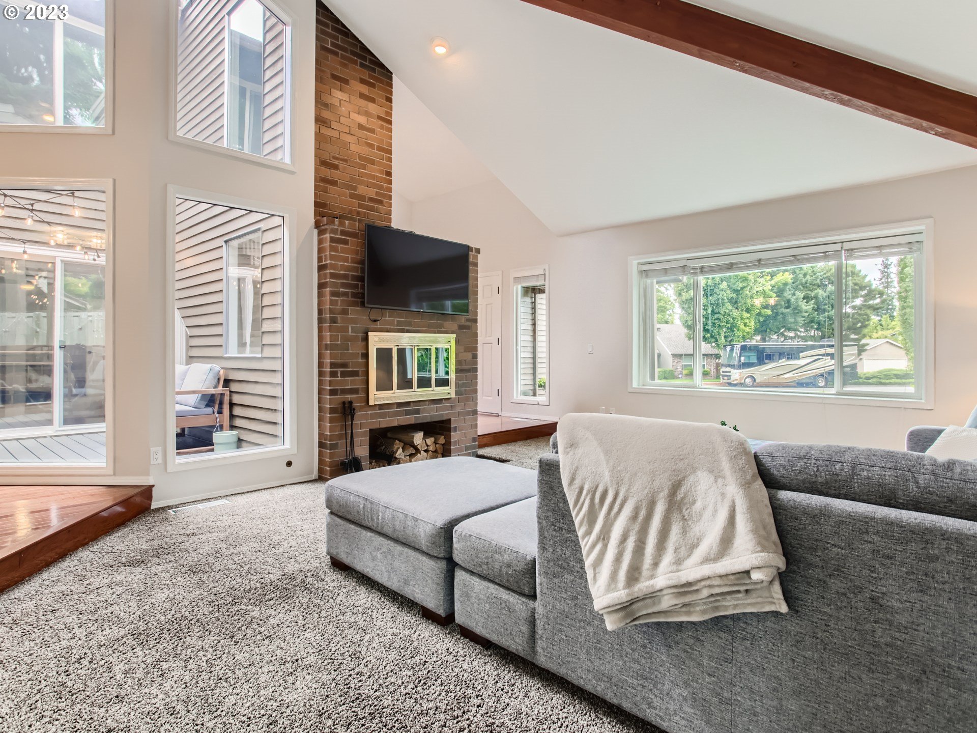 10230 Southwest Kickapoo Court Tualatin, OR 97062 - Photo 7 of 26 a spacious bedroom with a bed and a flat screen tv