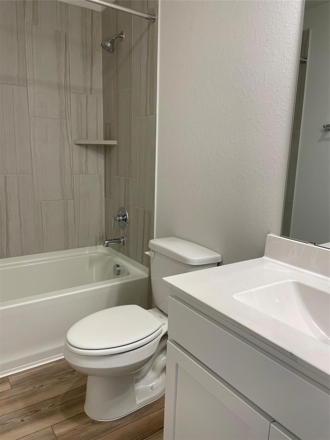 10638 Whitejacket Conroe, TX 77385 - Photo 11 of 25 a bathroom with a sink a toilet and bathtub