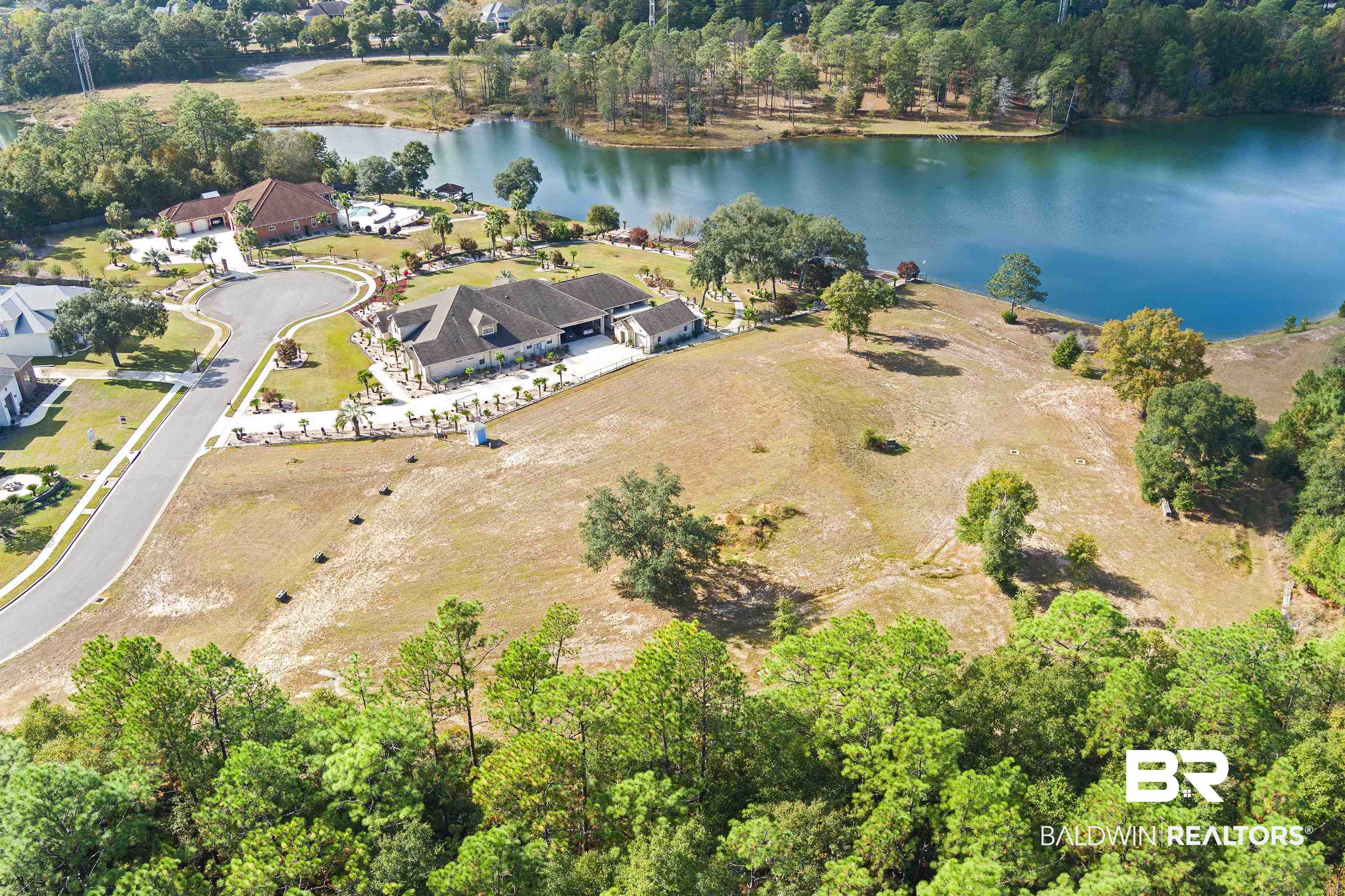 8512 Crepe Myrtle Court Mobile, AL 36619 - Photo 5 of 10 Aerial view of property's location with a nearby body of water and a heavily wooded area