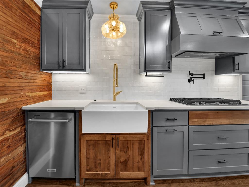 305 Gandy Street Lipan, TX 76462 - Photo 12 of 40 a kitchen with a sink and cabinets