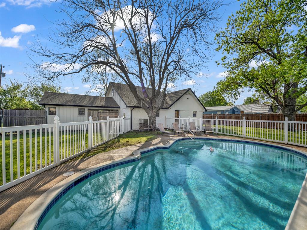 305 Gandy Street Lipan, TX 76462 - Photo 32 of 40 a view of a house with swimming pool and sitting area