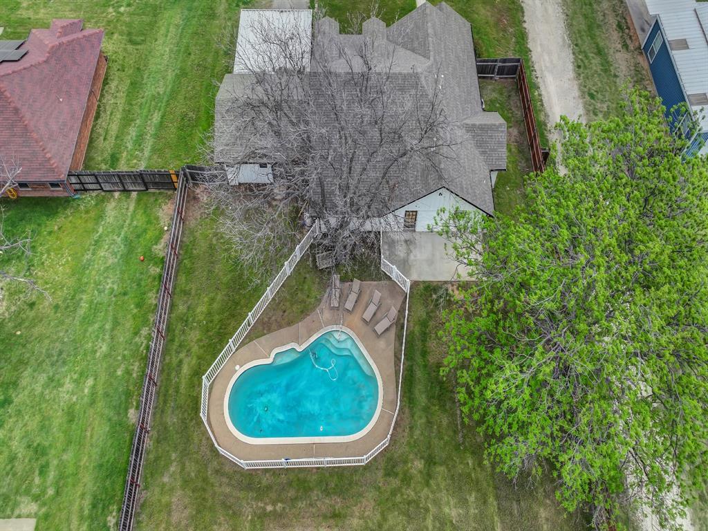 305 Gandy Street Lipan, TX 76462 - Photo 33 of 40 an aerial view of a house with a yard and lake view