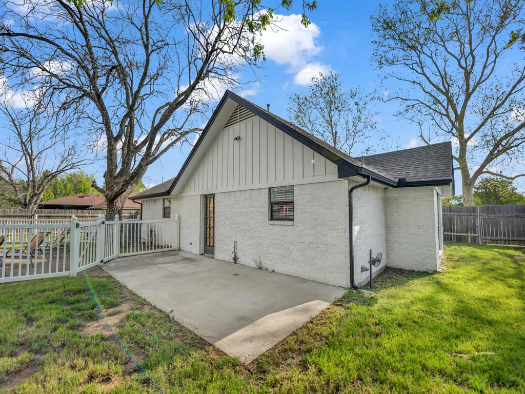 305 Gandy Street Lipan, TX 76462 - Photo 35 of 40 a view of a house with a yard