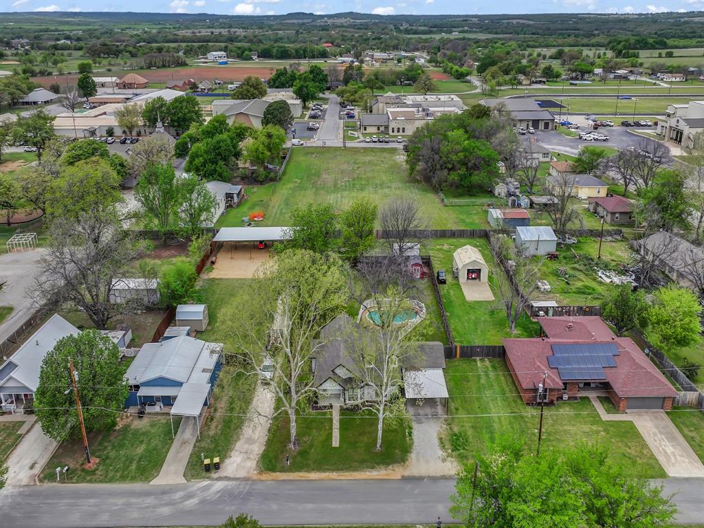 305 Gandy Street Lipan, TX 76462 - Photo 40 of 40 an aerial view of residential houses with outdoor space and parking space