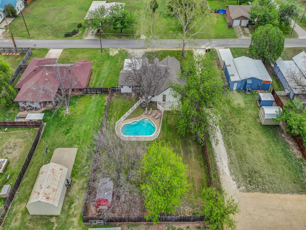 305 Gandy Street Lipan, TX 76462 - Photo 4 of 40 an aerial view of a house with outdoor space