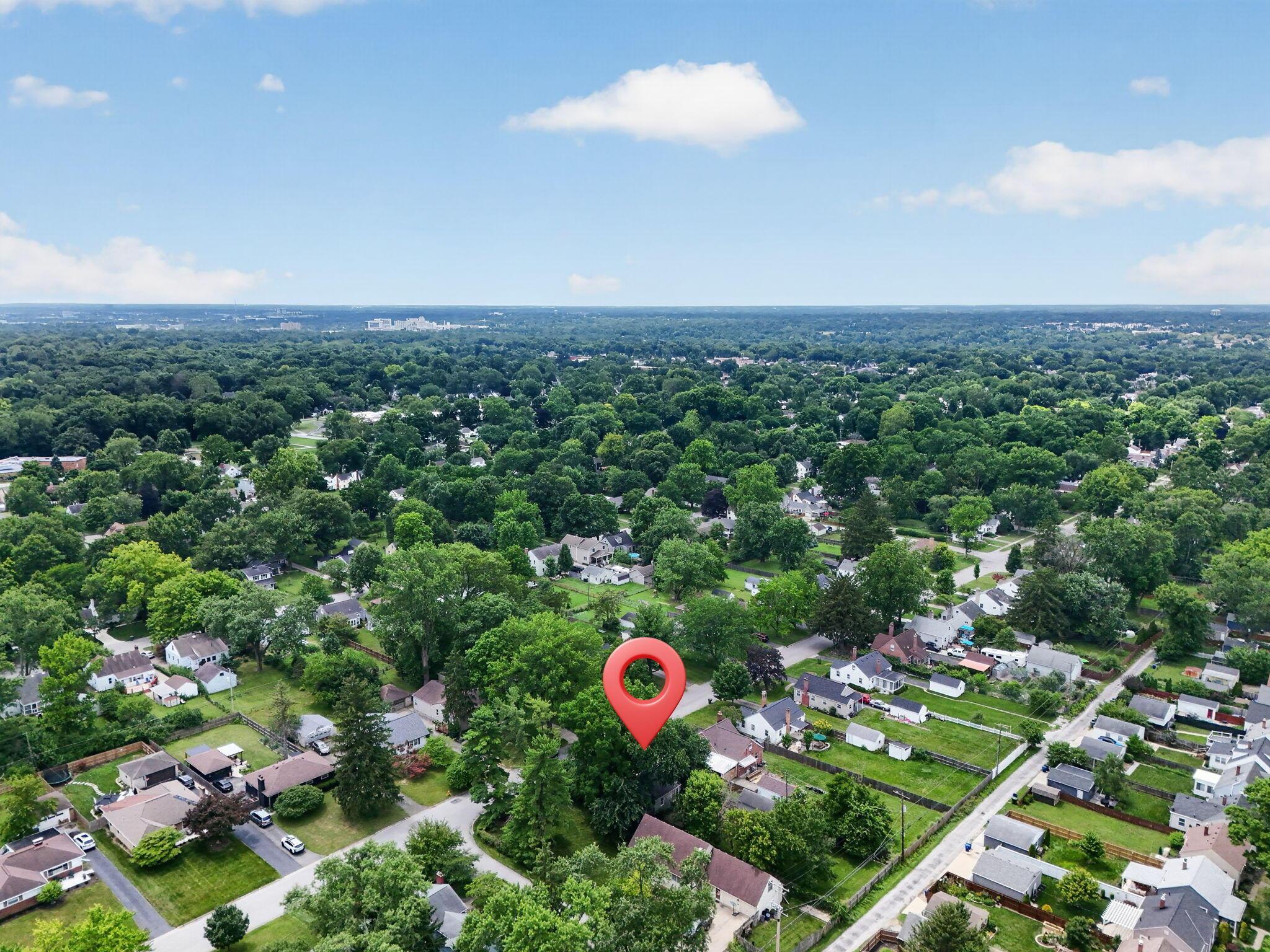 492 Wetmore Road Columbus, OH 43214 - Photo 52 of 55 Aerial overview of a residential area characterized by abundant mature trees and a mix of single-story and two-story homes