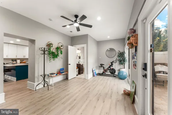 a bedroom with furniture and a wooden floor