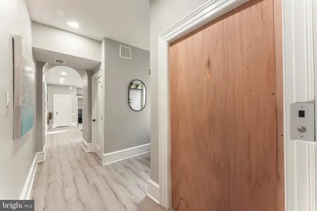 a view of entryway and hall with a window