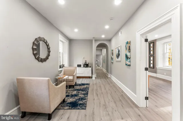 a living room with flat screen tv and a couch