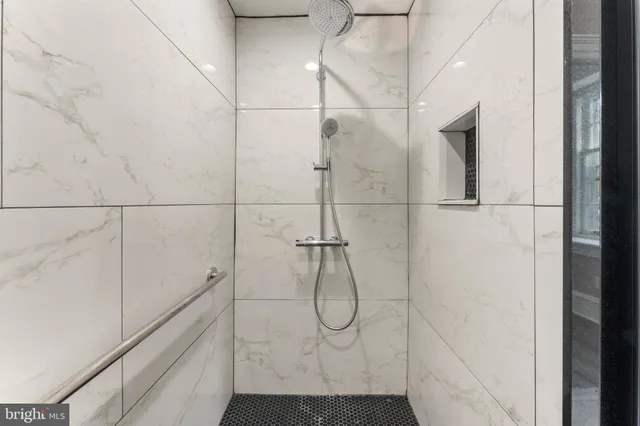 a bathroom with a glass shower door