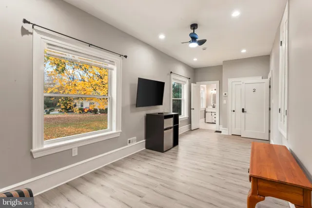 a bathroom with a toilet a sink and a mirror