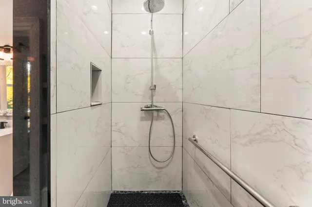 a spacious bedroom with a large bed and a couch