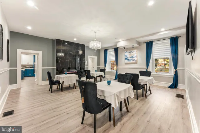 a kitchen with kitchen island stainless steel appliances a sink and counter space
