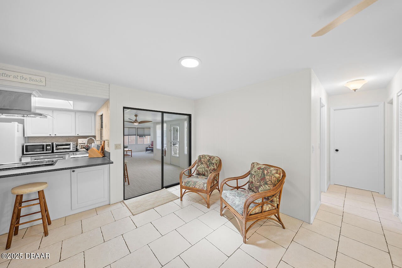80 Cindy Lane Ponce Inlet, FL 32127 - Photo 14 of 45 a kitchen with stainless steel appliances kitchen island granite countertop a refrigerator and a stove top oven