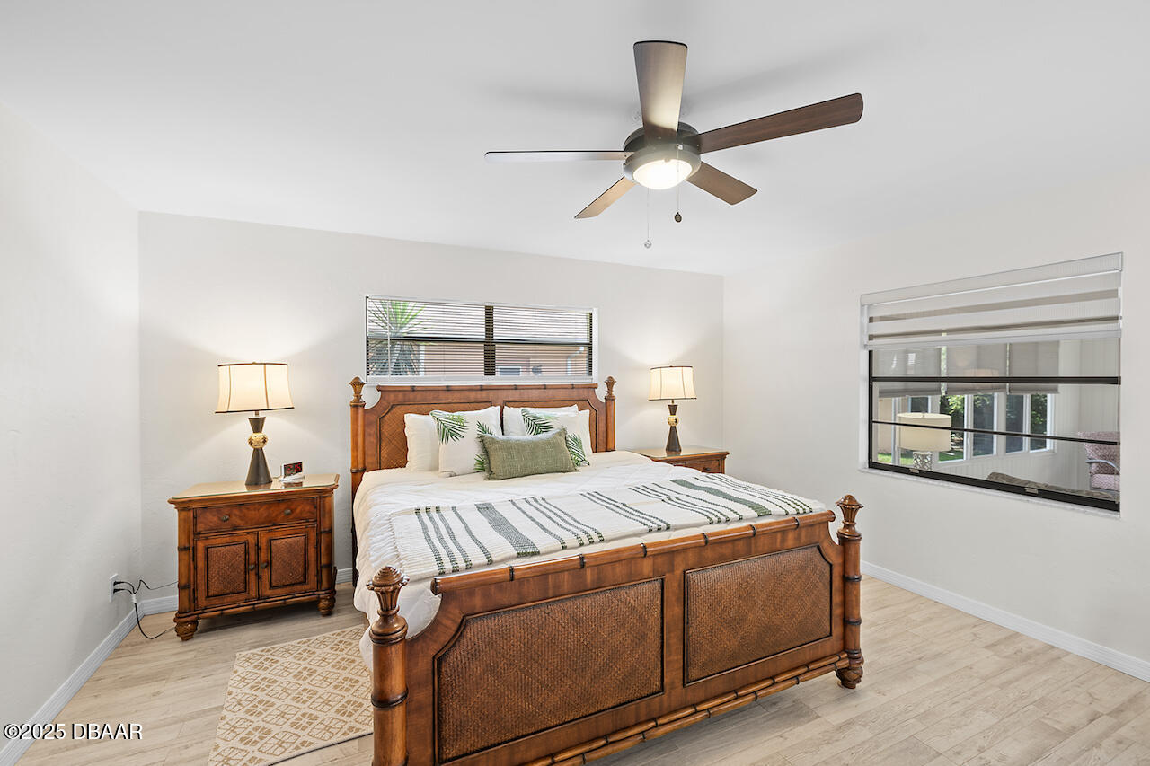 80 Cindy Lane Ponce Inlet, FL 32127 - Photo 18 of 45 a bedroom with a bed a window and closet