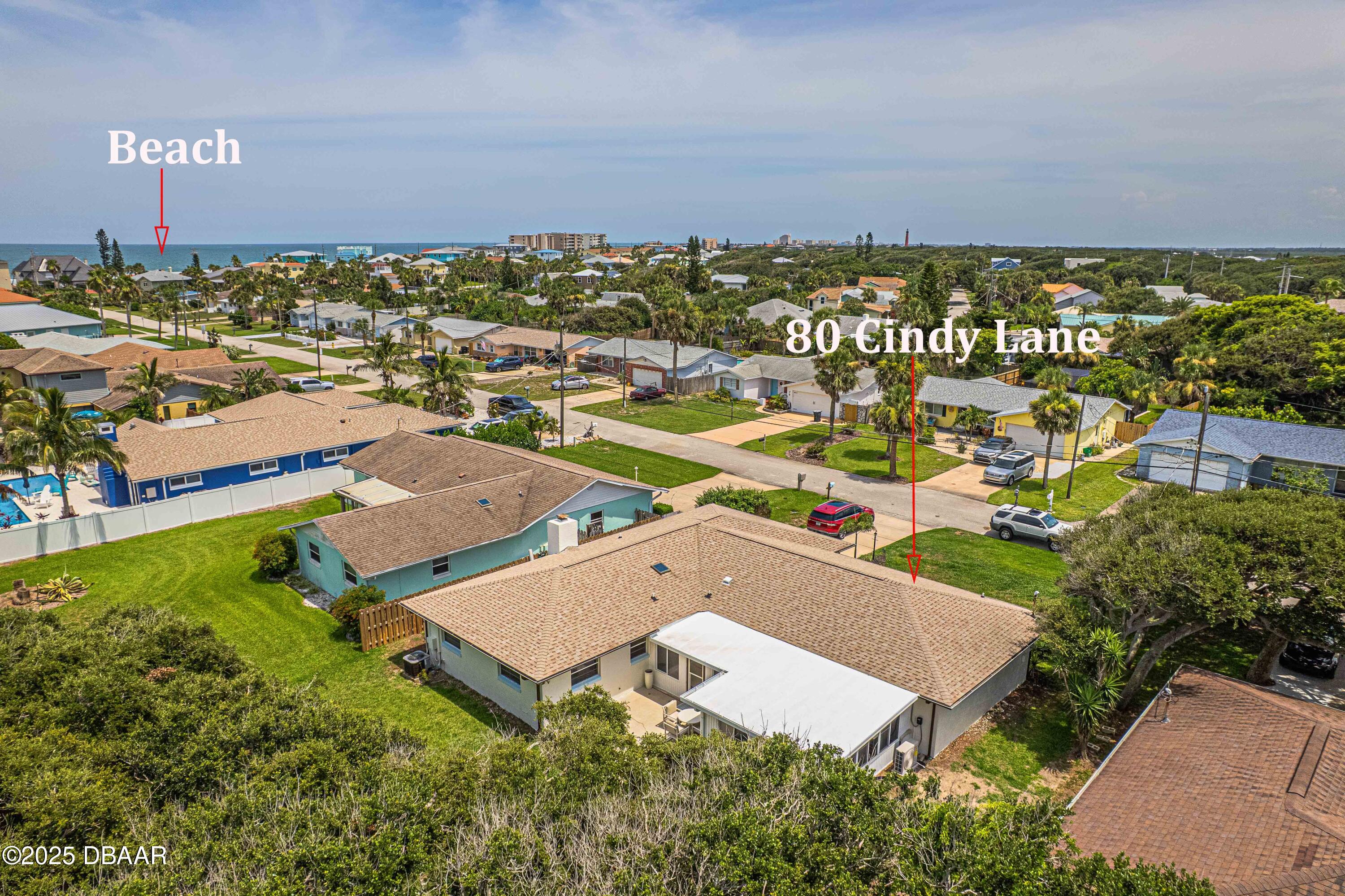 80 Cindy Lane Ponce Inlet, FL 32127 - Photo 2 of 45 an aerial view of a house with a garden
