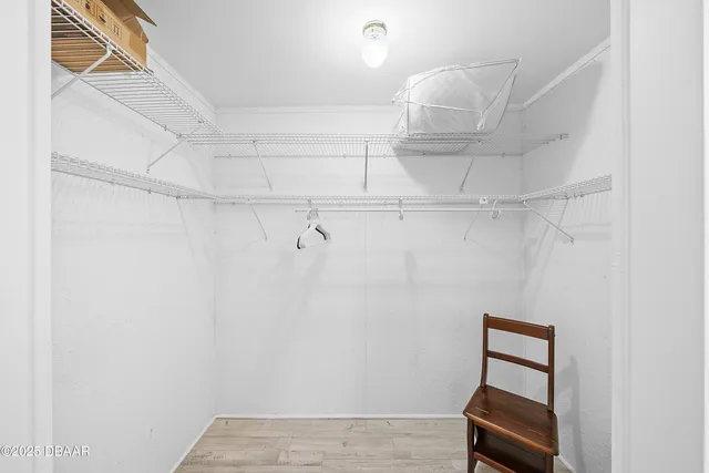 a view of room with racks on the wall