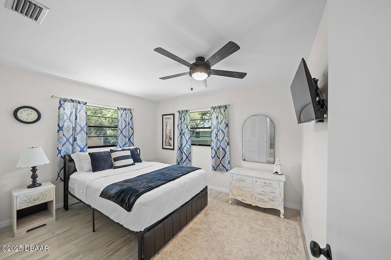 80 Cindy Lane Ponce Inlet, FL 32127 - Photo 27 of 45 a bedroom with bed and a window