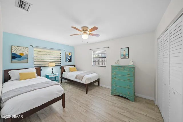 a bedroom with furniture and a large window