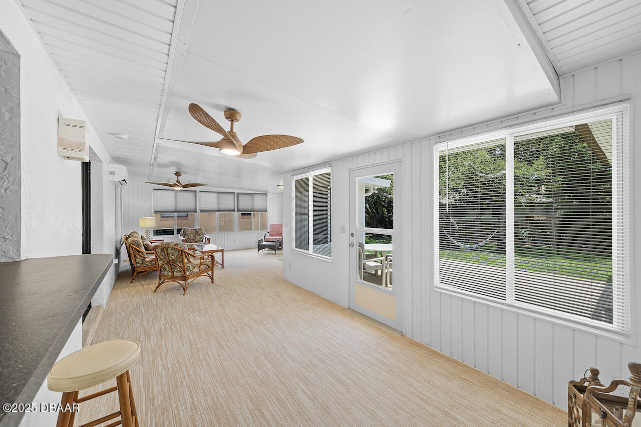 80 Cindy Lane Ponce Inlet, FL 32127 - Photo 36 of 45 a living room with furniture and a large window
