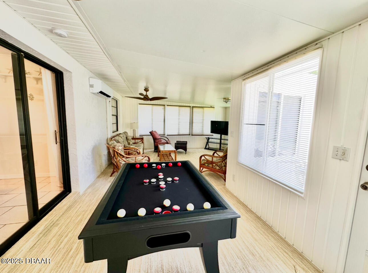 80 Cindy Lane Ponce Inlet, FL 32127 - Photo 37 of 45 a room with furniture a window and a flat screen tv