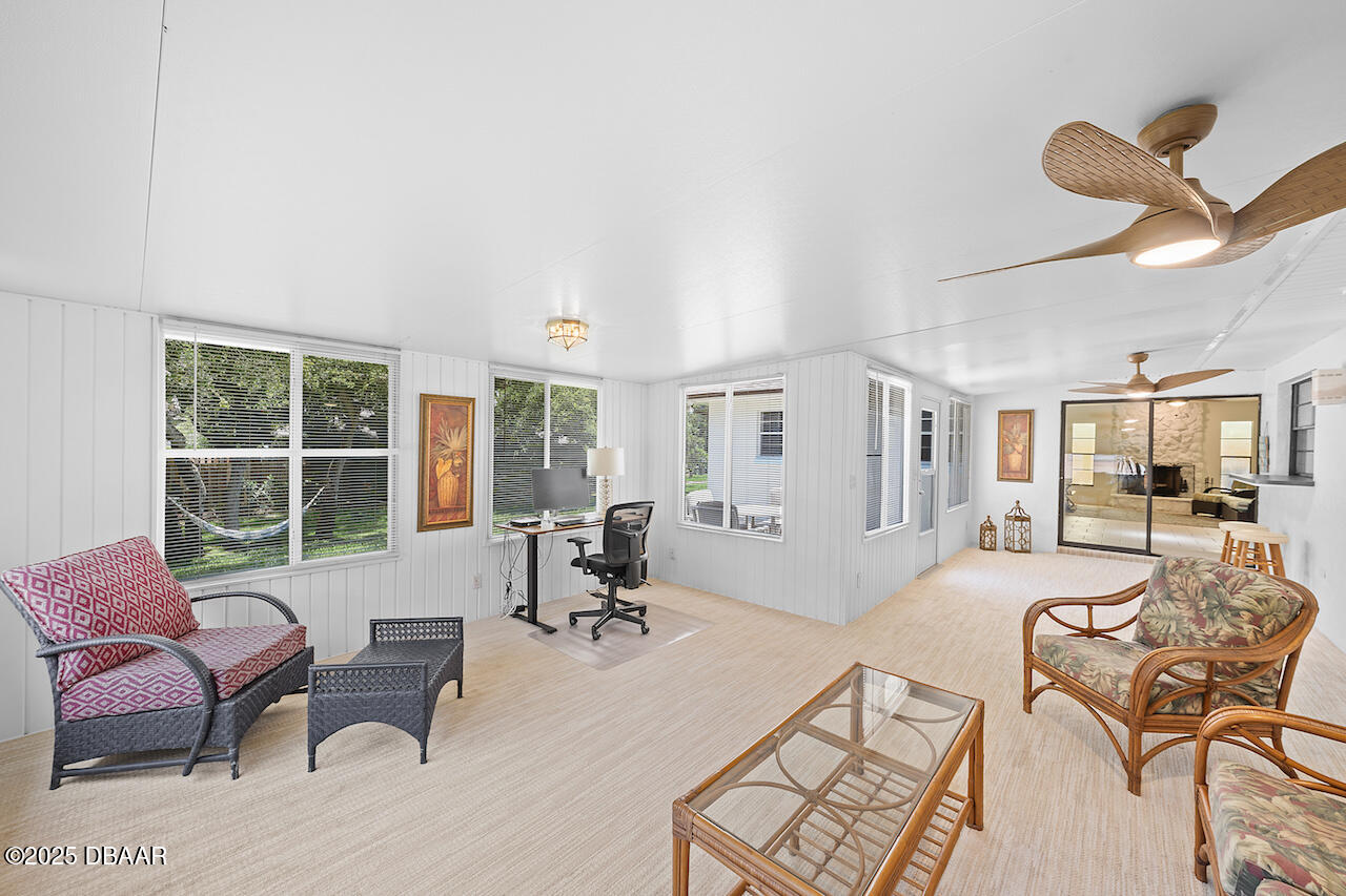 80 Cindy Lane Ponce Inlet, FL 32127 - Photo 40 of 45 a living room with furniture and a large window