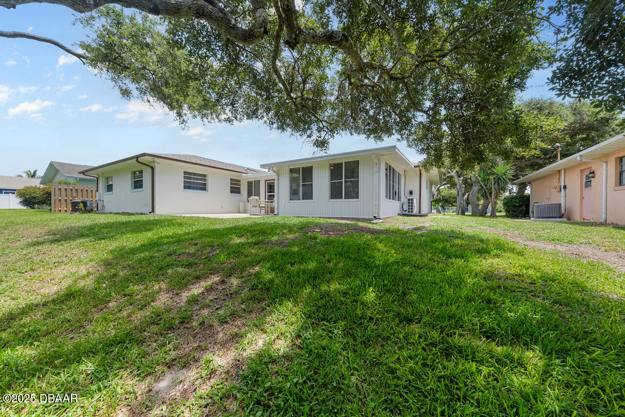 80 Cindy Lane Ponce Inlet, FL 32127 - Photo 44 of 45 a house view with a garden space