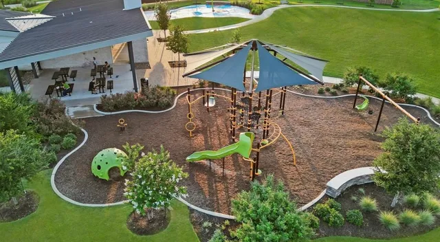 an aerial view of a house with swimming pool