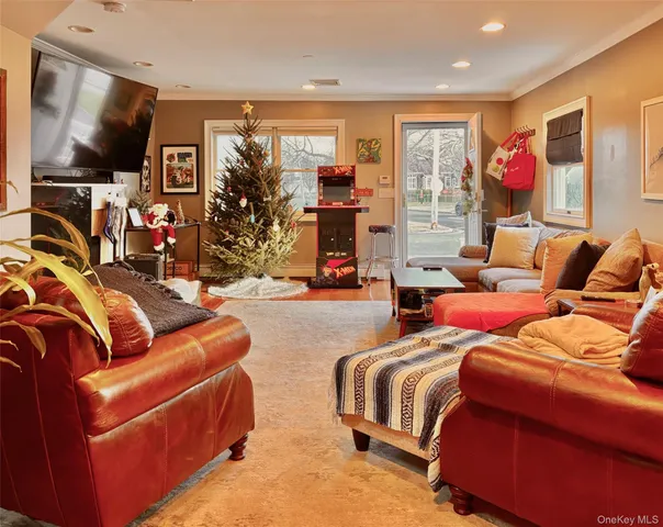 a bedroom with furniture and a flat screen tv