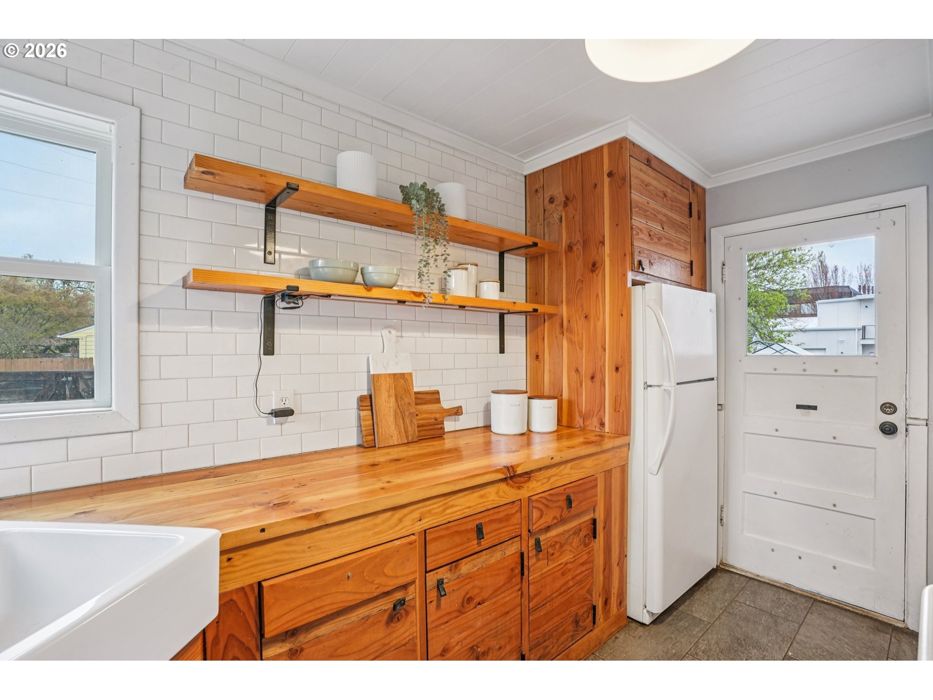 7921 Northeast Clackamas Street Portland, OR 97213 - Photo 12 of 31 a bathroom with a sink a mirror and a shower