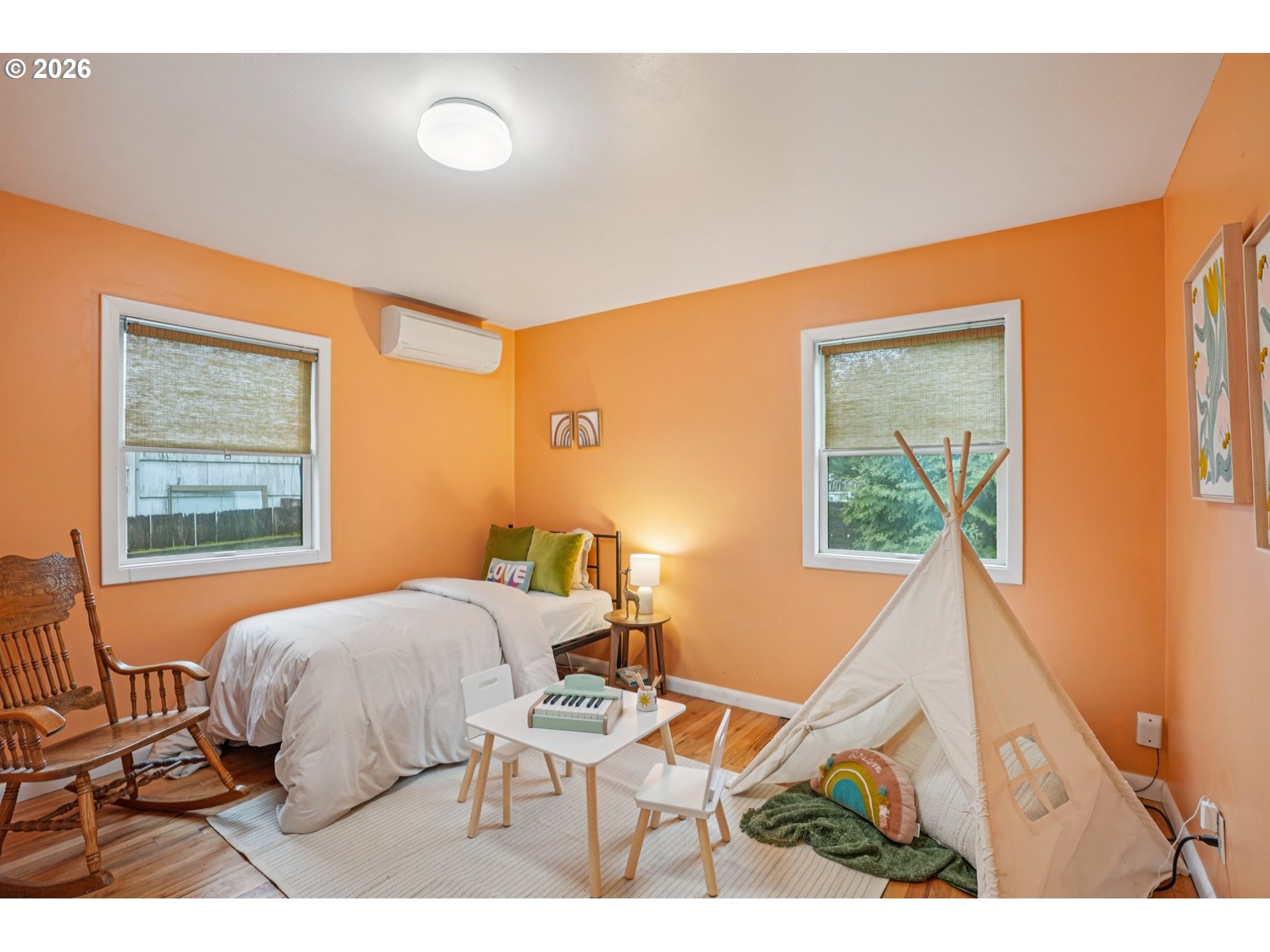 7921 Northeast Clackamas Street Portland, OR 97213 - Photo 13 of 31 a bedroom with a bed and a window