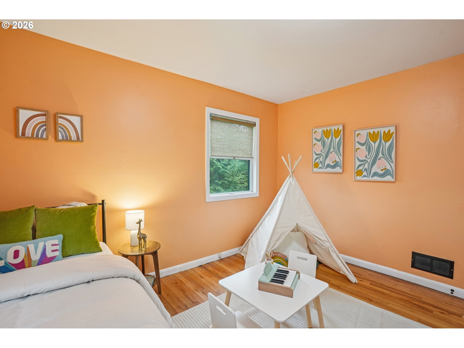 7921 Northeast Clackamas Street Portland, OR 97213 - Photo 14 of 31 a bedroom with a bed and a window