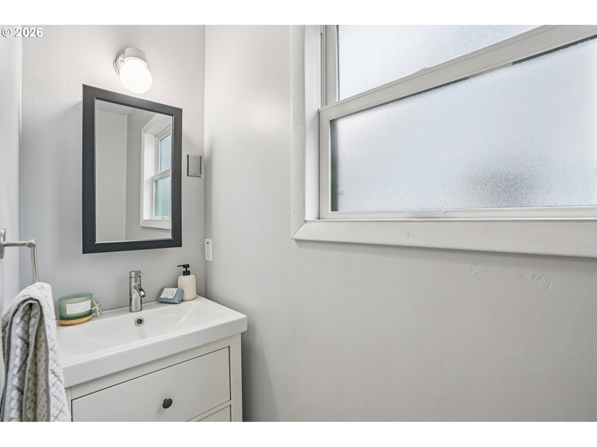 7921 Northeast Clackamas Street Portland, OR 97213 - Photo 15 of 31 a bathroom with a sink vanity and mirror