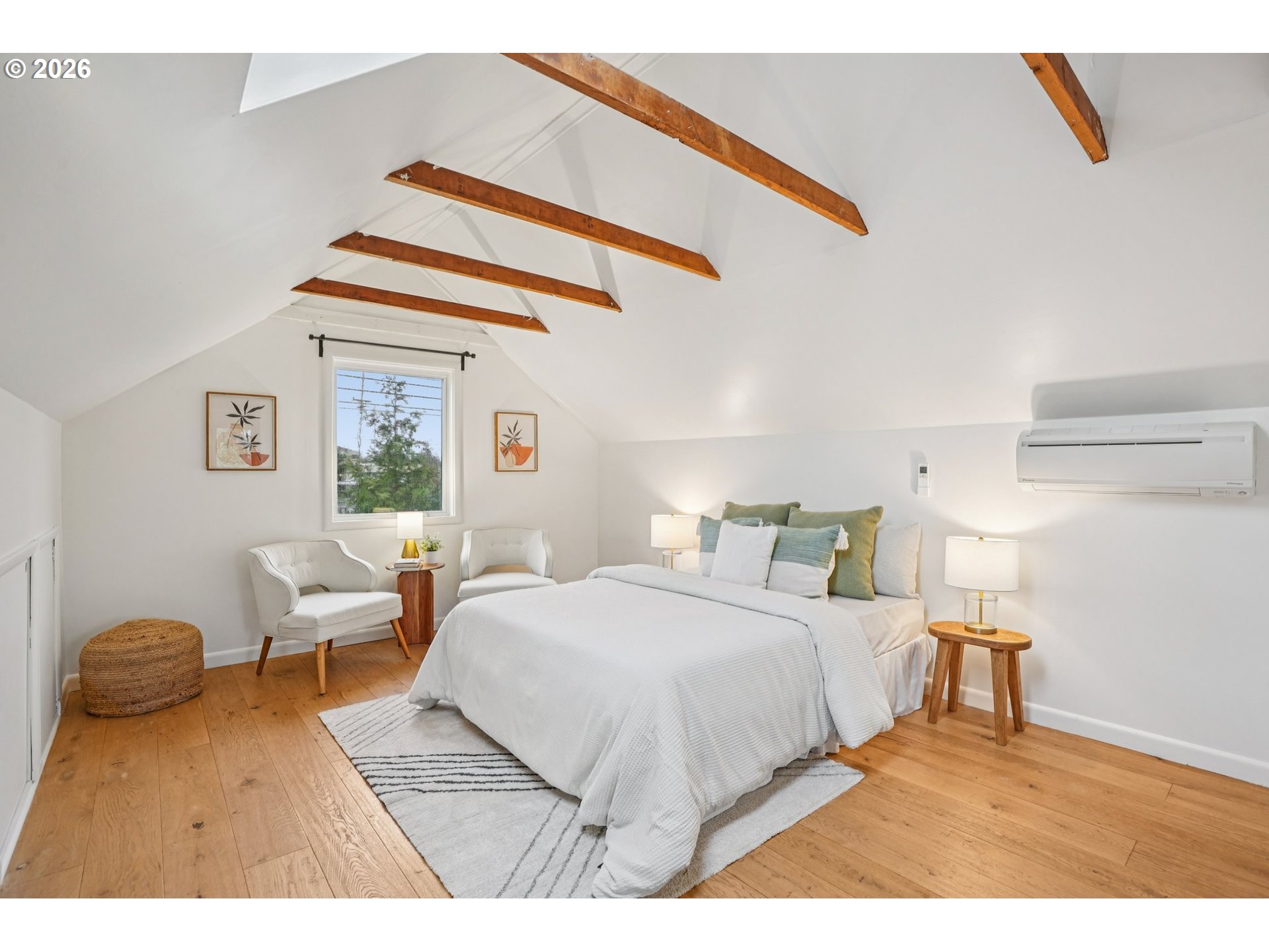 7921 Northeast Clackamas Street Portland, OR 97213 - Photo 19 of 31 a bedroom with a bed and a chandelier