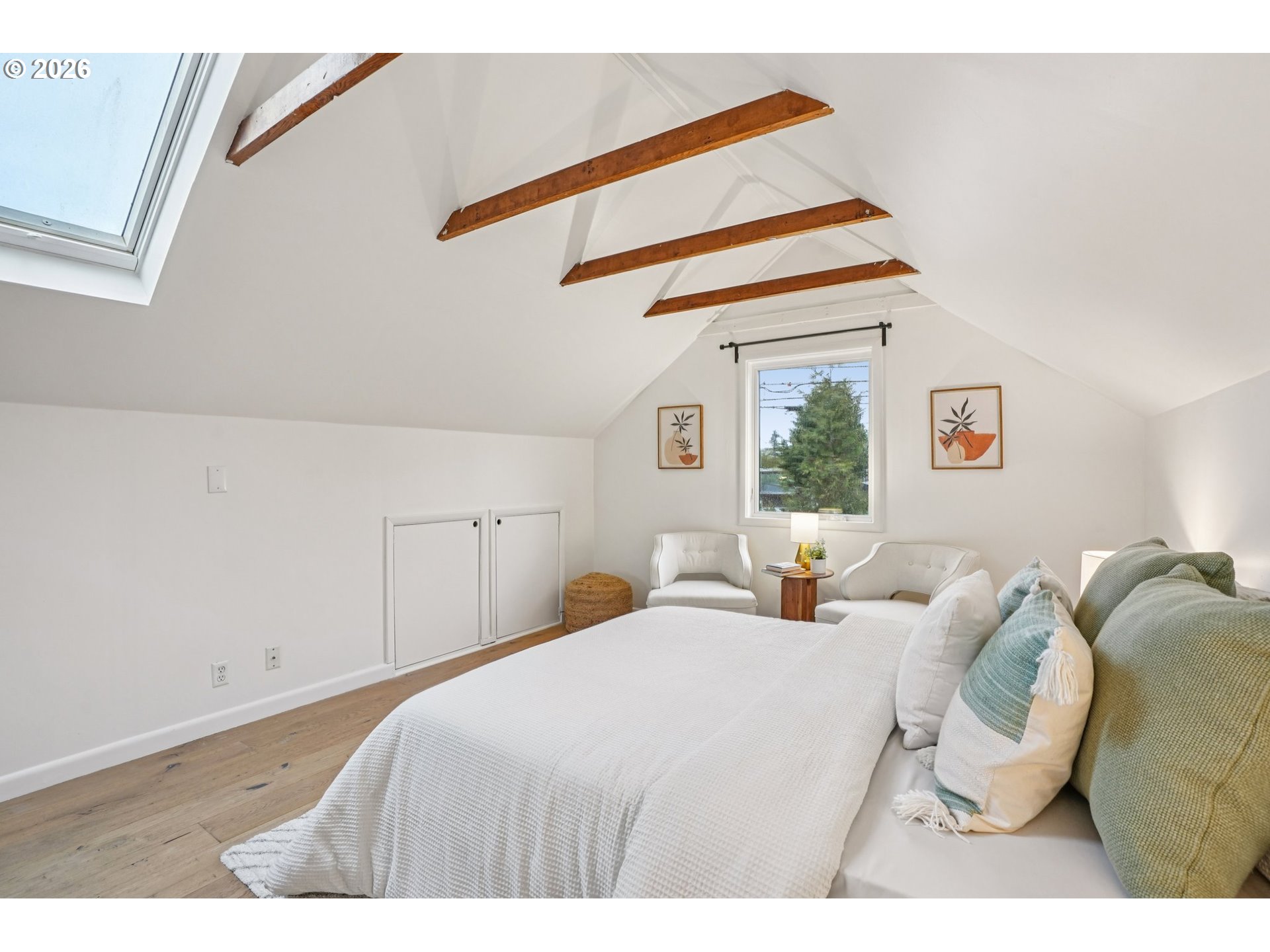 7921 Northeast Clackamas Street Portland, OR 97213 - Photo 20 of 31 a bedroom with a bed and a window