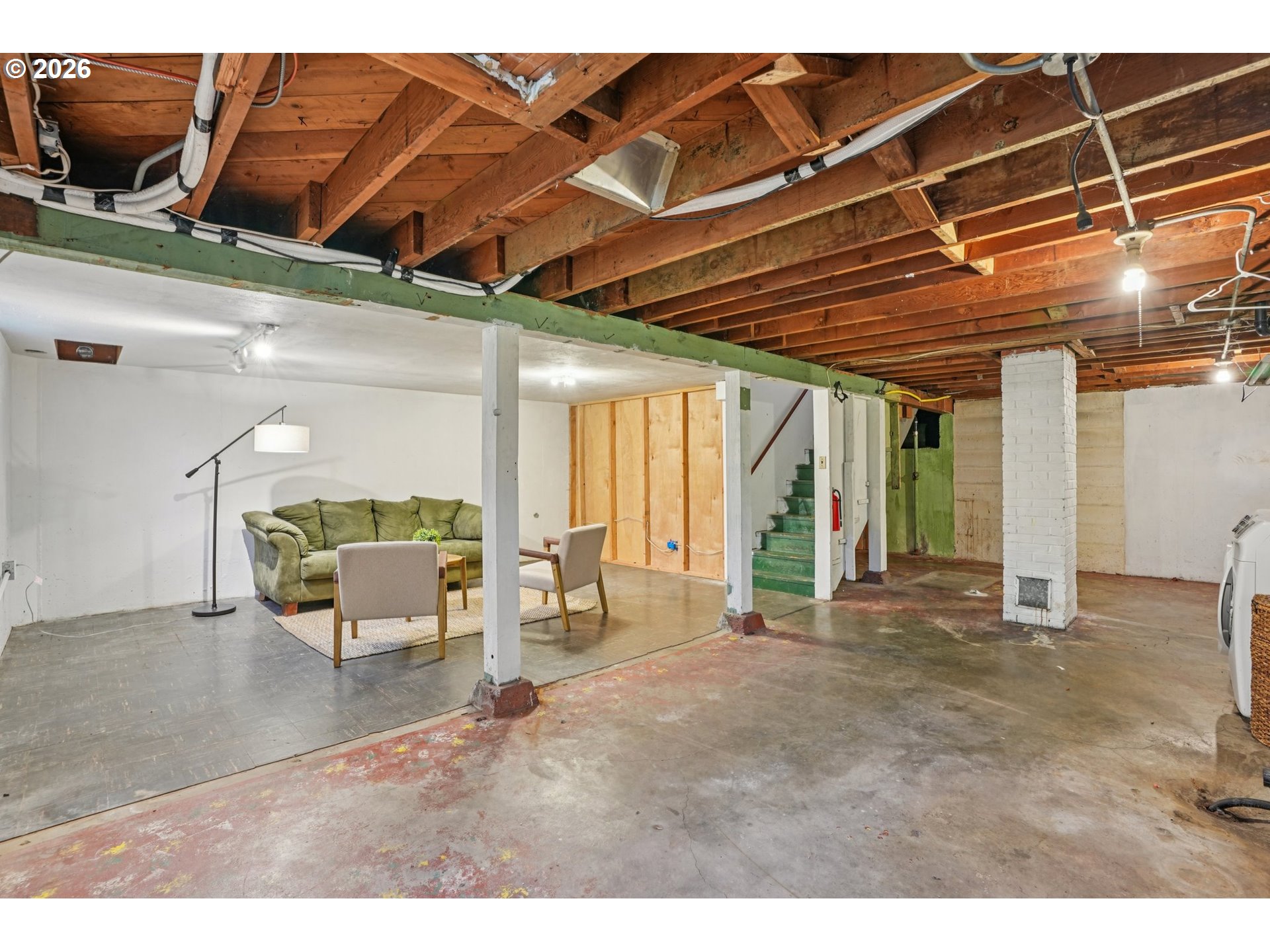 7921 Northeast Clackamas Street Portland, OR 97213 - Photo 23 of 31 a view of a room with wooden floor and furniture