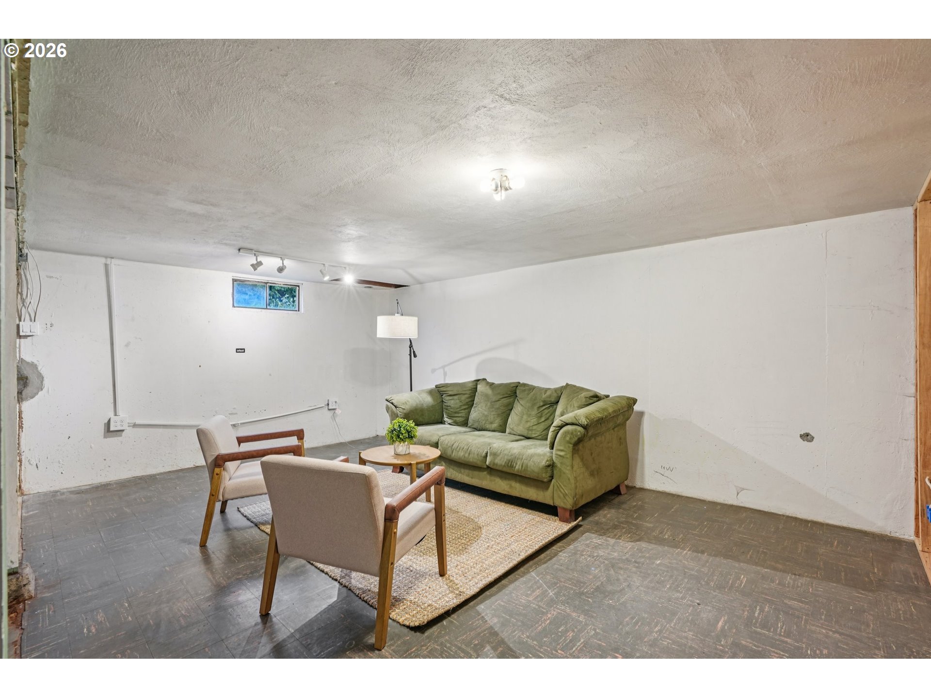 7921 Northeast Clackamas Street Portland, OR 97213 - Photo 25 of 31 a living room with furniture and a wooden floor