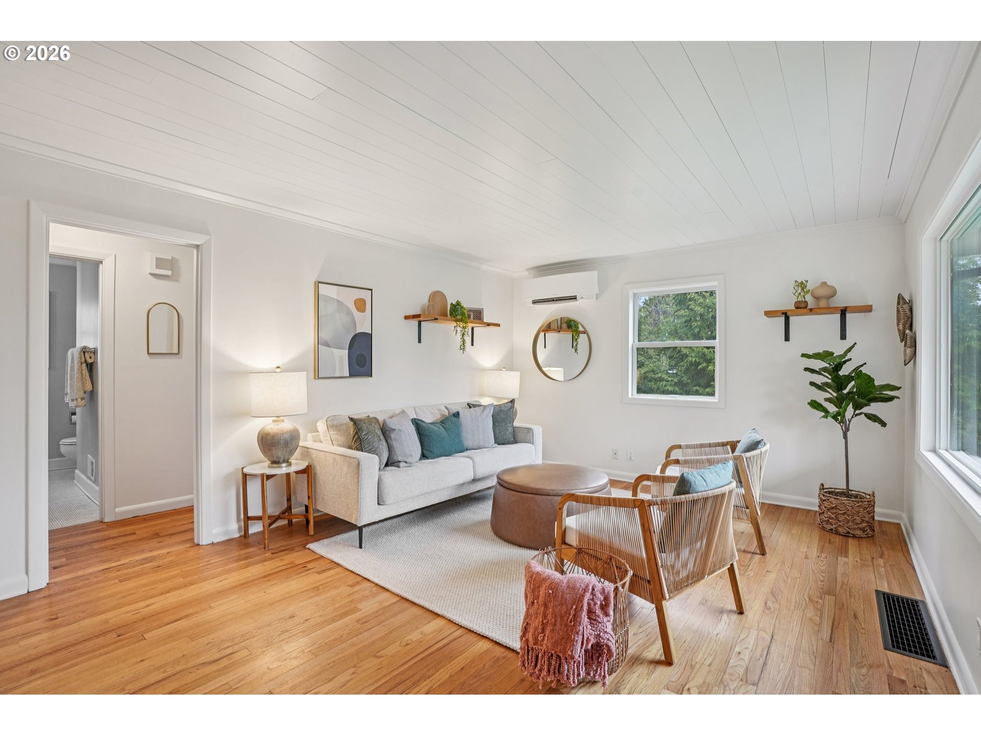 7921 Northeast Clackamas Street Portland, OR 97213 - Photo 4 of 31 a living room with furniture and a wooden floor