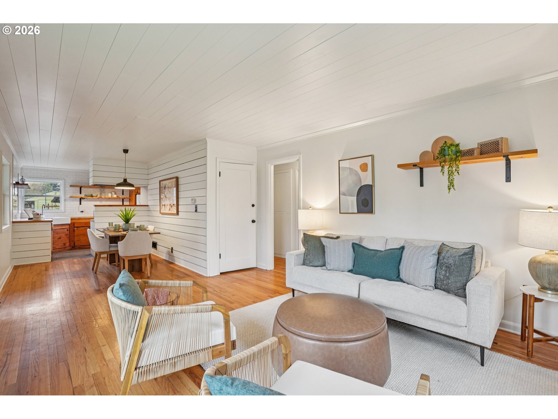 7921 Northeast Clackamas Street Portland, OR 97213 - Photo 5 of 31 a living room with furniture and a wooden floor